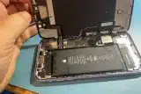 Liquid damaged iPhone opened up to display how water has damaged the interior