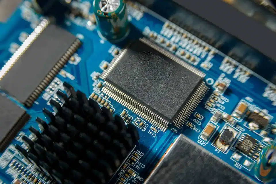A computer chip placed on a motherboard of a computer interior
